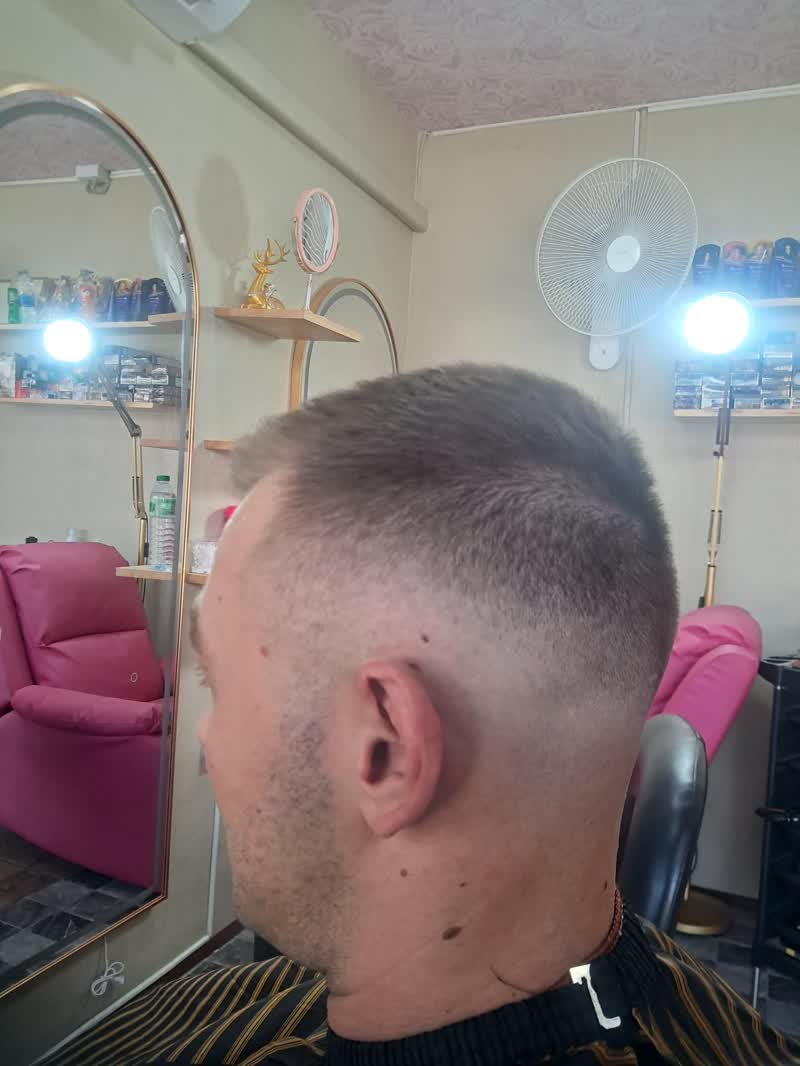 Close-up of a freshly clipped fade at the back of the head