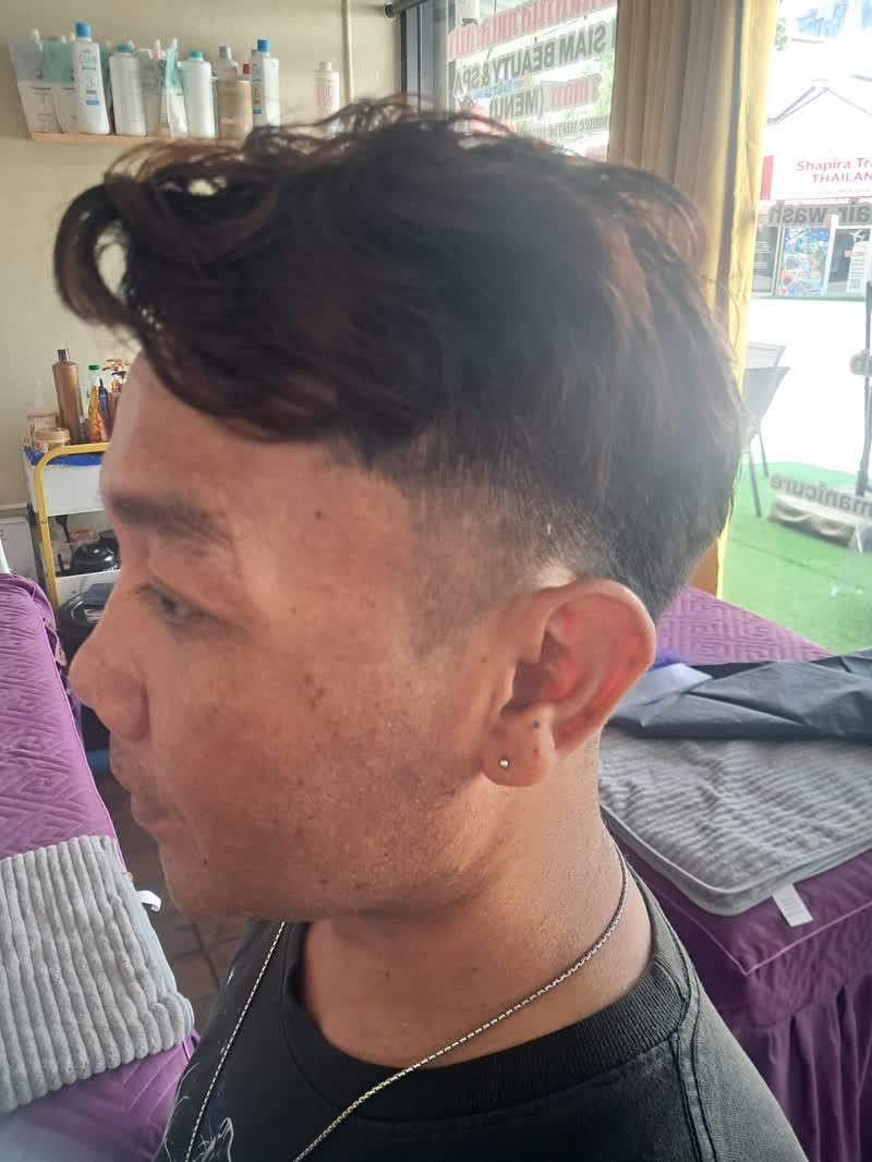 Side view of a fresh undercut with longer hair on top