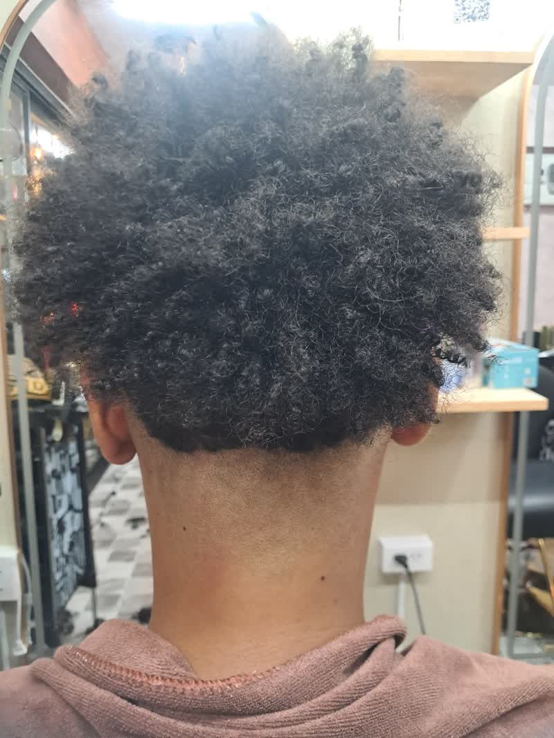Short curly black hair with a cleanly shaved neckline