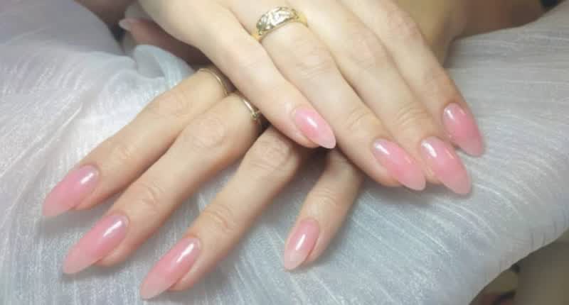 Long almond nails in soft light pink