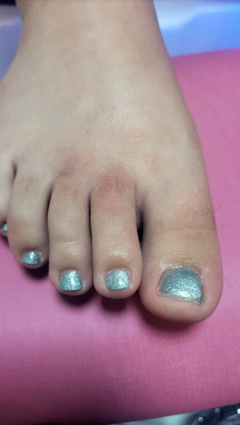 Pedicure with sparkling mint green toenails