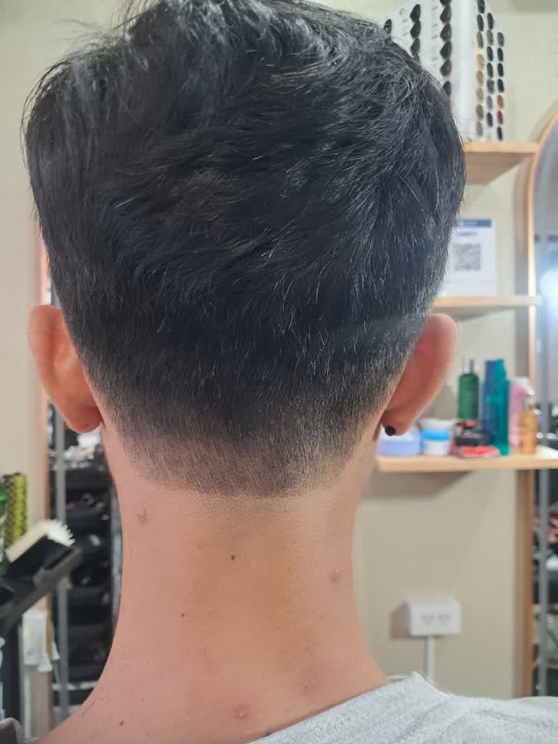 Back of a fresh taper cut with a clean neckline