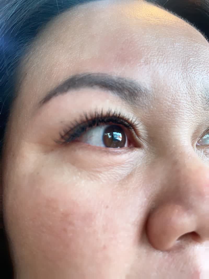 Close-up of long dark lash extensions