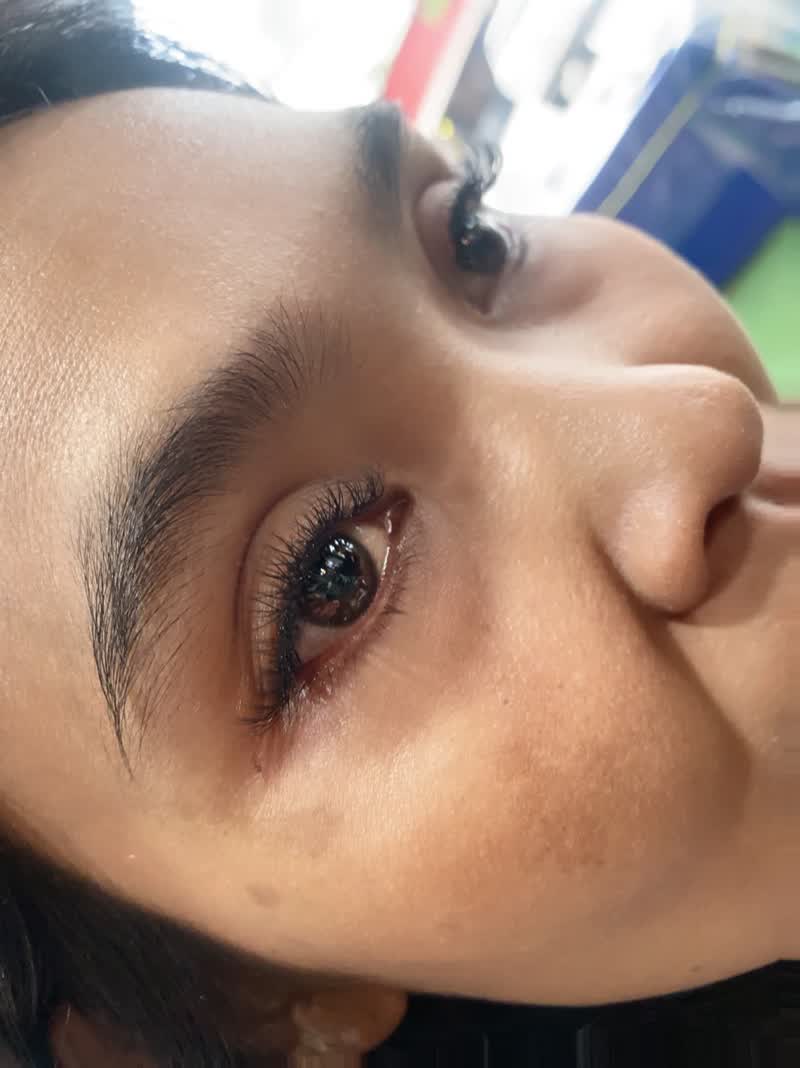 Both eyes with dark brows and long lashes