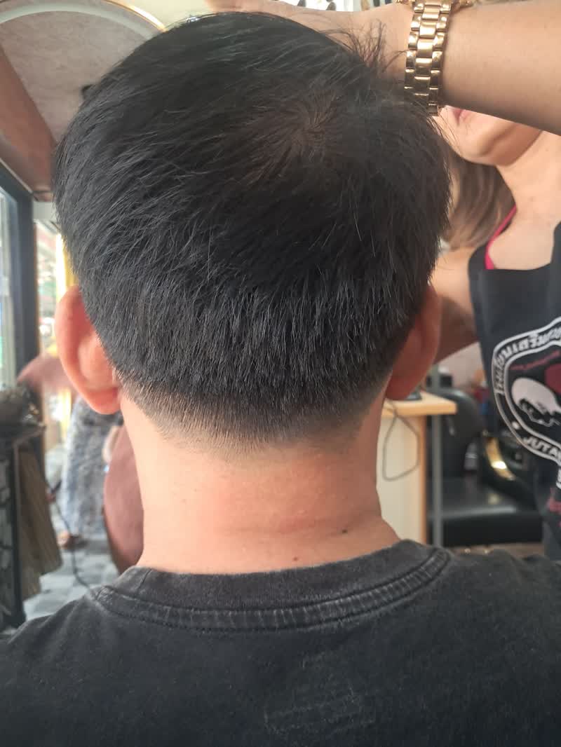 Back of a short trimmed cut with a sharp neckline